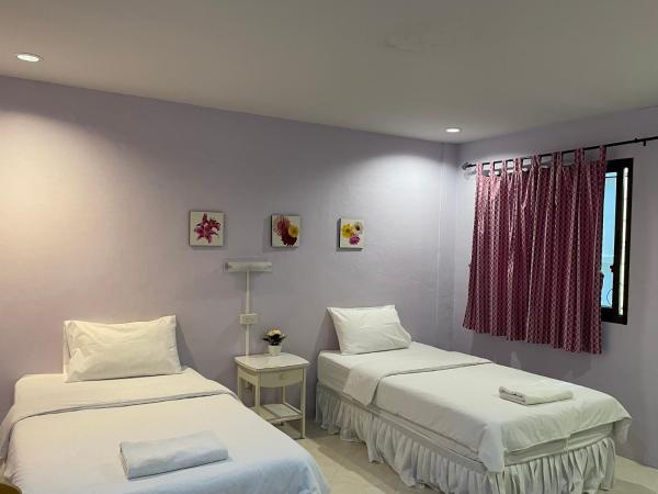 Nawaporn Place : photo 1 de la chambre chambre lits jumeaux standard