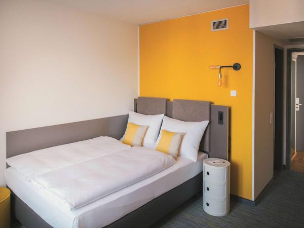 Vienna House Easy by Wyndham Leipzig : photo 3 de la chambre chambre confort accessible aux personnes à mobilité réduite