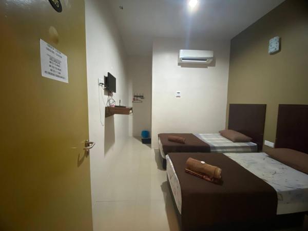 TGL Aparthotel Tanjung Lumpur : photo 1 de la chambre chambre lits jumeaux standard
