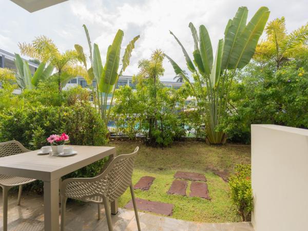 Hill Side Karon Kata Beach Condo : photo 1 de la chambre appartement - vue sur piscine 