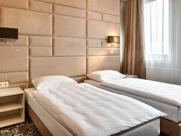 Citi Hotel's Łódź : photo 1 de la chambre chambre lits jumeaux standard