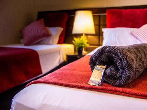 Ascot Budget Inn & Residences : photo 1 de la chambre chambre lits jumeaux Économique avec salle de bains commune