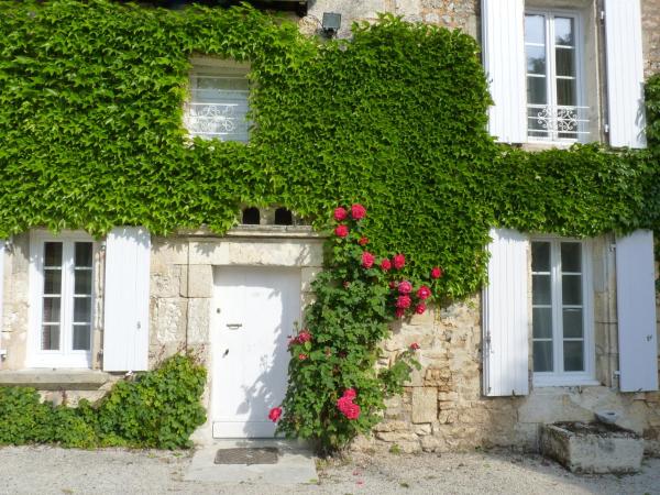 Domaine du Champ Fleuri : photo 2 de la chambre chambre lit queen-size - vue sur jardin