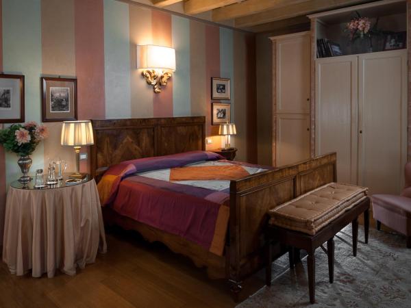 Domus Nova Palace - Italian Homing : photo 7 de la chambre chambre double ou lits jumeaux - vue sur ville