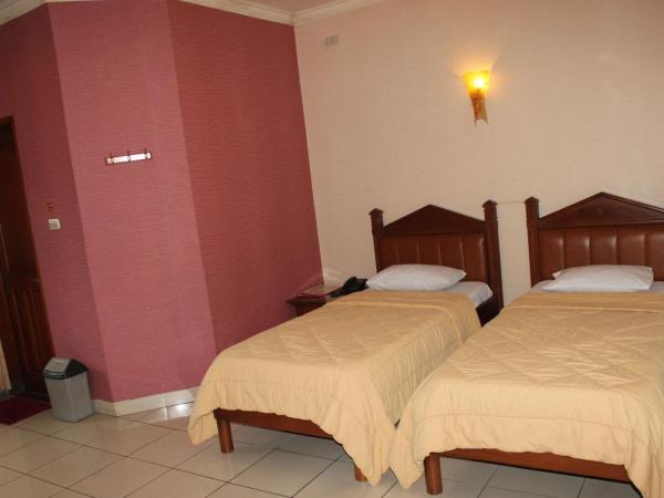 Hotel 678 Cawang powered by Cocotel : photo 1 de la chambre chambre lits jumeaux