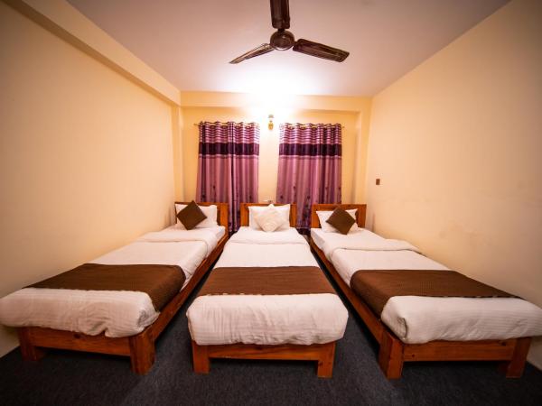 Dharma Backpackers : photo 1 de la chambre chambre triple standard