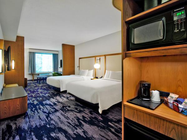 Fairfield by Marriott Inn & Suites Orlando at FLAMINGO CROSSINGS® Town Center : photo 1 de la chambre suite avec 2 lits queen-size et canapé-lit