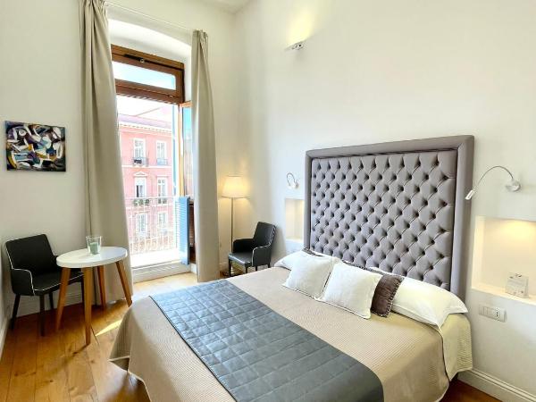 Antico Corso Charme : photo 1 de la chambre chambre double ou lits jumeaux deluxe - vue sur ville