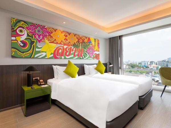 Maitria Hotel Rama 9 Bangkok - A Chatrium Collection : photo 6 de la chambre chambre lits jumeaux premier - vue sur jardin
