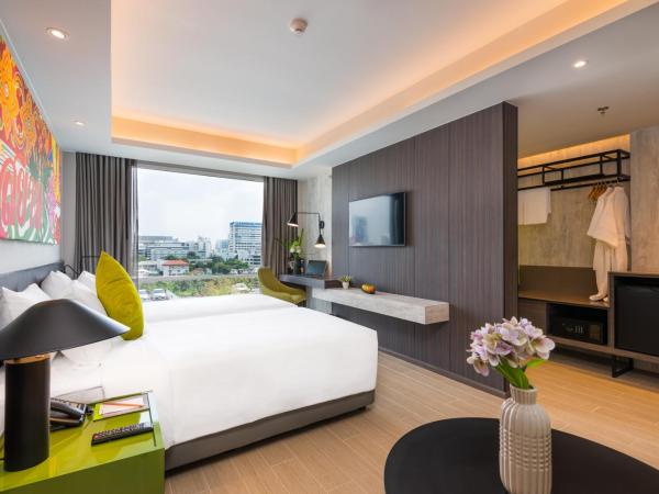 Maitria Hotel Rama 9 Bangkok - A Chatrium Collection : photo 3 de la chambre chambre lits jumeaux premier - vue sur jardin