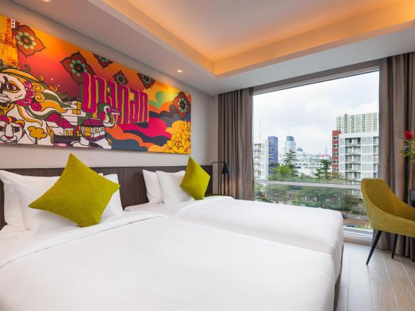 Maitria Hotel Rama 9 Bangkok - A Chatrium Collection : photo 7 de la chambre chambre lits jumeaux supérieure – vue sur jardin