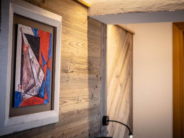 Les Plaisirs d'Antan : photo 9 de la chambre suite lit king-size avec baignoire spa