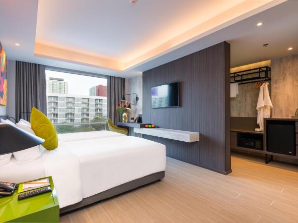 Maitria Hotel Rama 9 Bangkok - A Chatrium Collection : photo 10 de la chambre chambre lits jumeaux supérieure – vue sur jardin