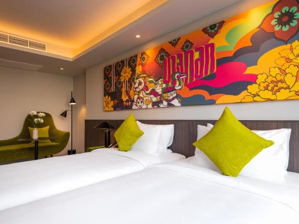 Maitria Hotel Rama 9 Bangkok - A Chatrium Collection : photo 9 de la chambre chambre lits jumeaux supérieure – vue sur jardin
