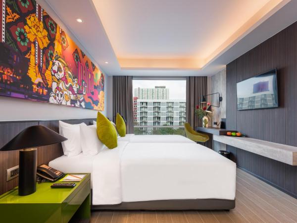Maitria Hotel Rama 9 Bangkok - A Chatrium Collection : photo 6 de la chambre chambre lits jumeaux supérieure – vue sur jardin