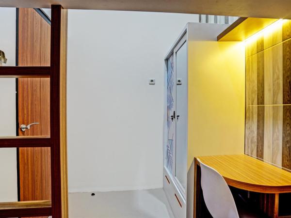 OYO 92435 Sunlo Cozy Home Family Homestay Syariah : photo 6 de la chambre chambre lits jumeaux Économique