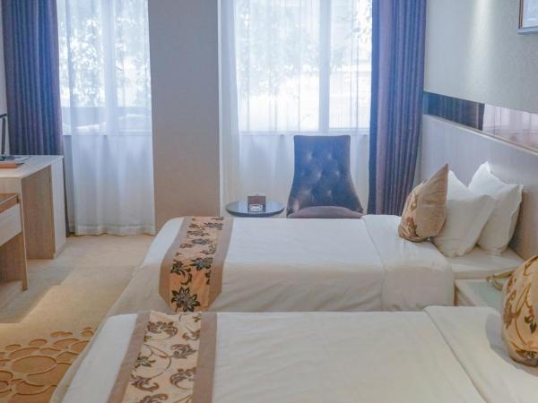 Paco Hotel Tianhe Coach Terminal Metro Guangzhou : photo 10 de la chambre chambre lits jumeaux deluxe