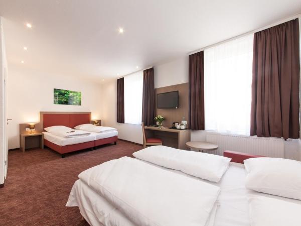 Hotel Excelsior Dortmund Hauptbahnhof : photo 1 de la chambre chambre double avec canapé-lit