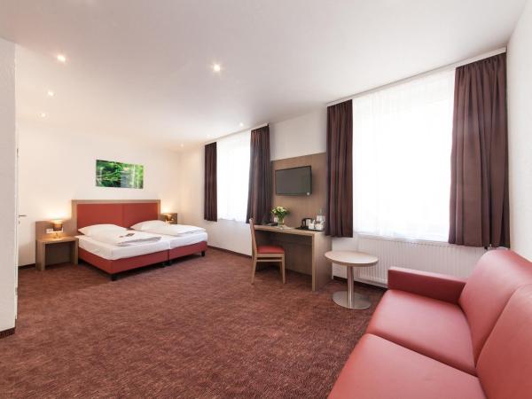 Hotel Excelsior Dortmund Hauptbahnhof : photo 4 de la chambre chambre double avec canapé-lit