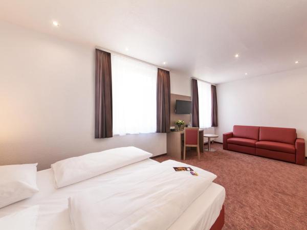 Hotel Excelsior Dortmund Hauptbahnhof : photo 6 de la chambre chambre double avec canapé-lit