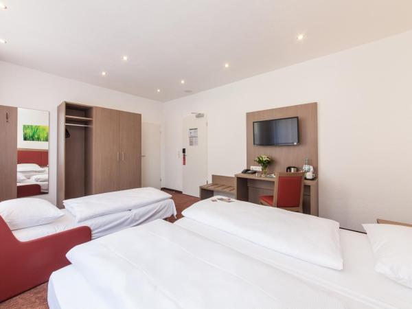 Hotel Excelsior Dortmund Hauptbahnhof : photo 1 de la chambre chambre double (1 adulte et 1 enfant)