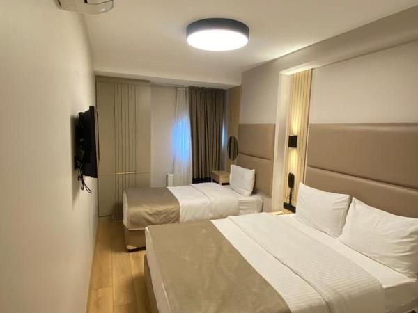 Otel Yenikapı : photo 1 de la chambre chambre triple Économique