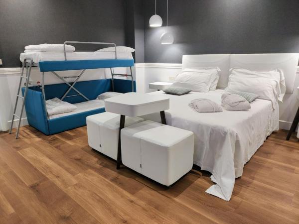 Villa Adriatica Ambienthotels : photo 1 de la chambre chambre quadruple deluxe