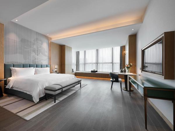 Qingdao Oriental Studio Chuangzhi SSAW Hotel : photo 1 de la chambre chambre d'affaires exécutive avec lit king-size 