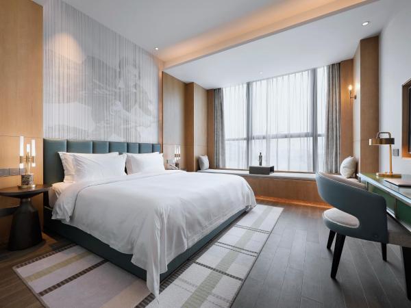 Qingdao Oriental Studio Chuangzhi SSAW Hotel : photo 3 de la chambre chambre lit king-size affaires