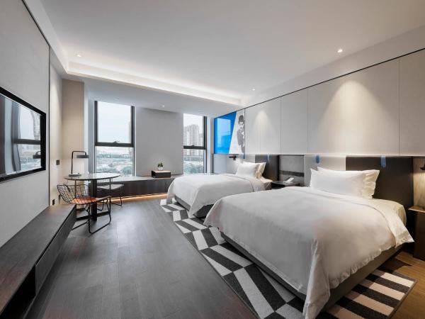 Qingdao Oriental Studio Chuangzhi SSAW Hotel : photo 2 de la chambre chambre affaires lits jumeaux