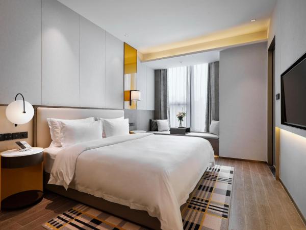 Qingdao Oriental Studio Chuangzhi SSAW Hotel : photo 3 de la chambre chambre lit king-size deluxe