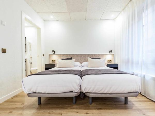 Auditorio Rooms Boutique Oviedo : photo 1 de la chambre chambre double ou lits jumeaux