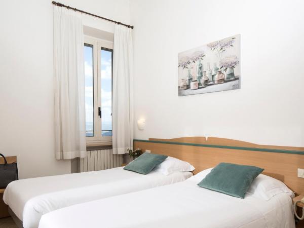 Hotel Sacro Cuore : photo 4 de la chambre chambre lits jumeaux - vue sur jardin