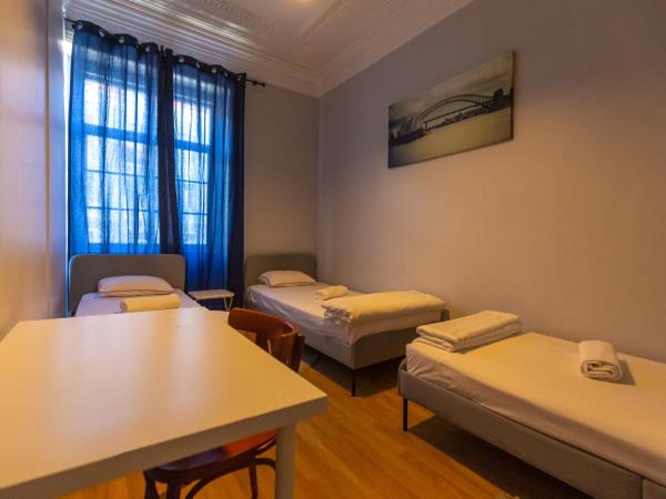 The Delight Hostel : photo 1 de la chambre chambre triple basique avec salle de bains commune