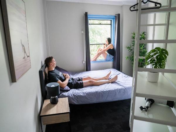 Mad Monkey Downtown : photo 2 de la chambre chambre triple avec salle de bains commune