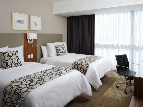 Casa Inn Premium Hotel Queretaro : photo 2 de la chambre chambre avec 2 lits doubles queen-size