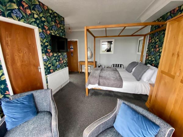 The Fossil Tree Hotel : photo 3 de la chambre chambre double de luxe avec lit à baldaquin - vue sur mer