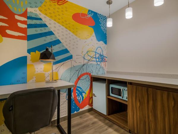 Signature Inn Houston Galleria : photo 2 de la chambre suite lit king-size