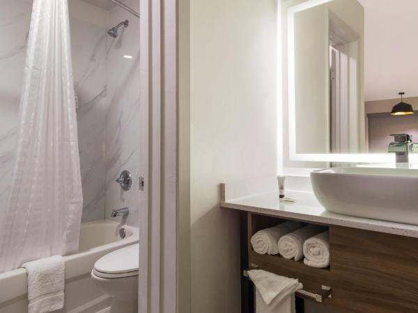 Signature Inn Houston Galleria : photo 6 de la chambre suite lit queen-size