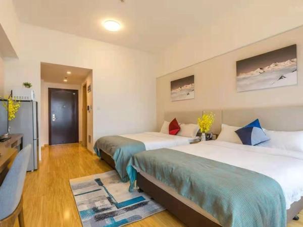 Livetour Hotel Shenzhou Road Metro Guangzhou : photo 2 de la chambre chambre lits jumeaux exécutive