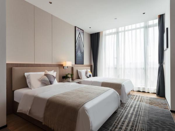 Livetour Hotel Shenzhou Road Metro Guangzhou : photo 2 de la chambre chambre lits jumeaux Élégante