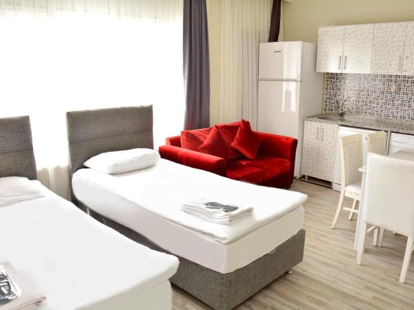 palmiye suıt otel : photo 10 de la chambre appartement