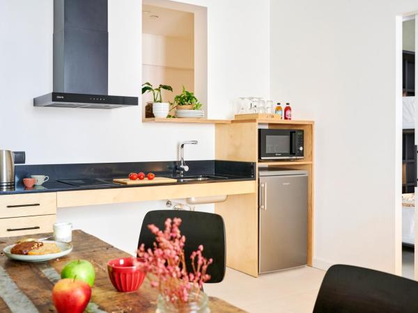 Eco Boutique Hostal Grau : photo 5 de la chambre appartement 1 chambre avec salon et cuisine