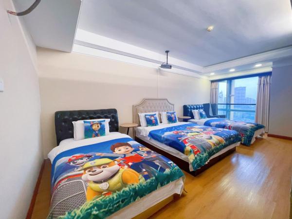 Youlejia Projection Apartment Guangzhou Beijing Road Pedestrian Street Branch : photo 1 de la chambre chambre lit king-size ou lits jumeaux supérieure