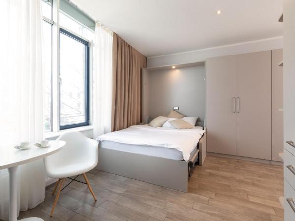 Brera Serviced Apartments Munich West : photo 3 de la chambre appartement confortable avec cuisine