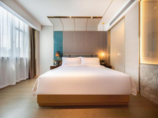 Paco Hotel Guangzhou South Railway Station Panyu Changlong Branch : photo 7 de la chambre chambre supérieure lit queen-size