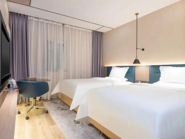 Chaoman Hotel -Guangzhou Shijing City Plaza Xiaoping Subway Station : photo 4 de la chambre chambre lits jumeaux deluxe