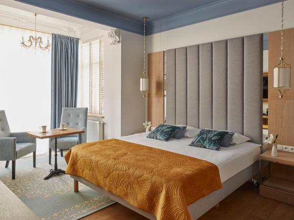 Villa Antonina : photo 8 de la chambre chambre double deluxe (2 adultes + 1 enfant)