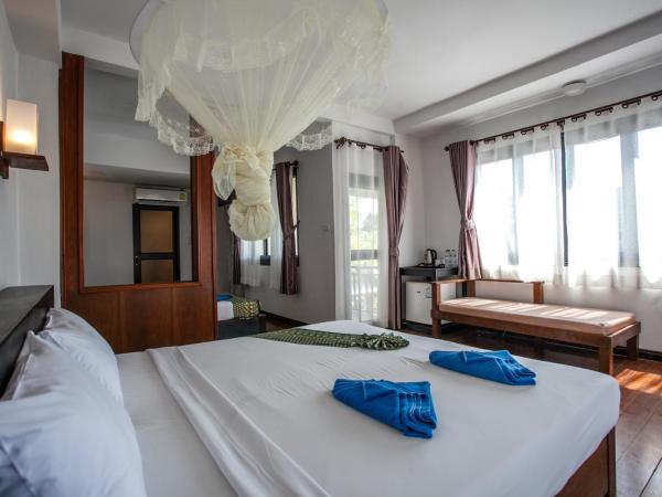 Phitharom PP Resort : photo 2 de la chambre chambre triple