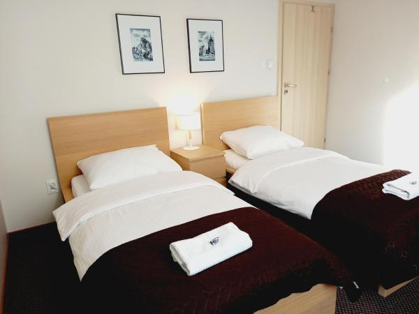 Villa AgaTomDom : photo 2 de la chambre chambre lits jumeaux